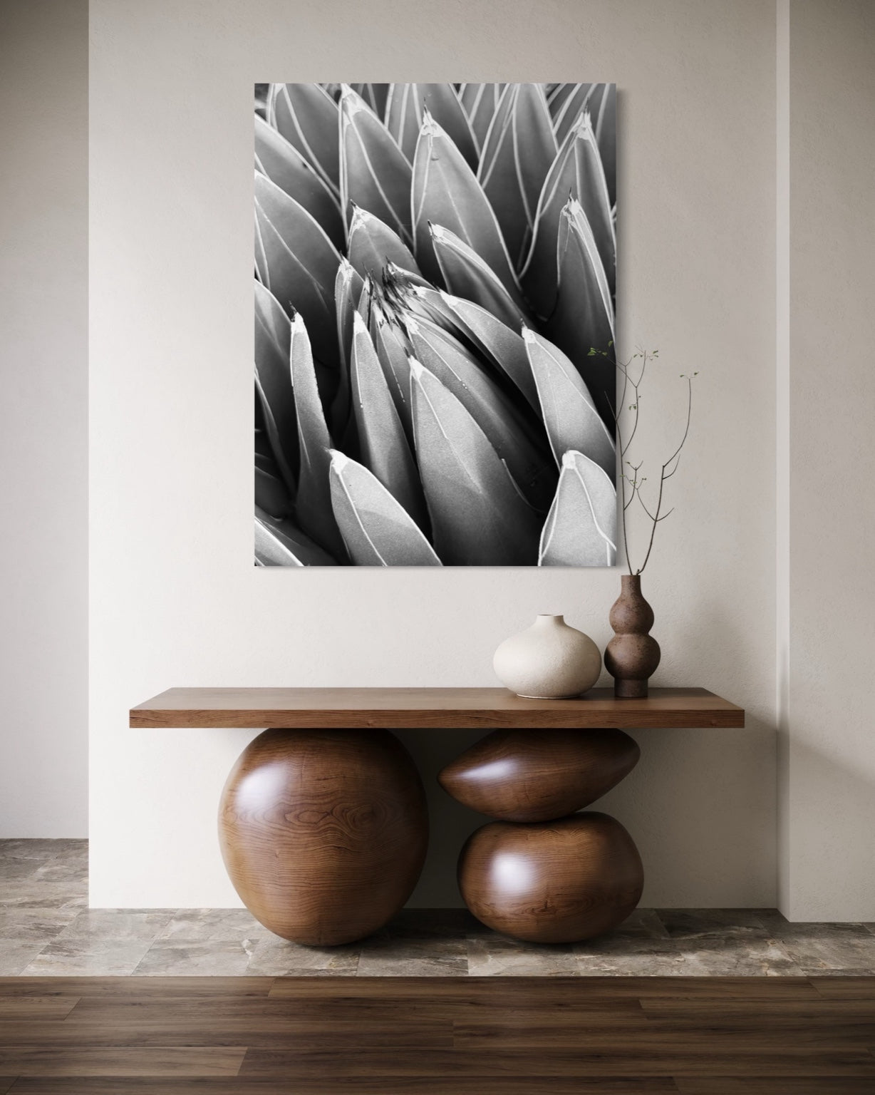 Crown of Quiet above a sculptural console table, its sharp lines enhancing the organic shapes below.