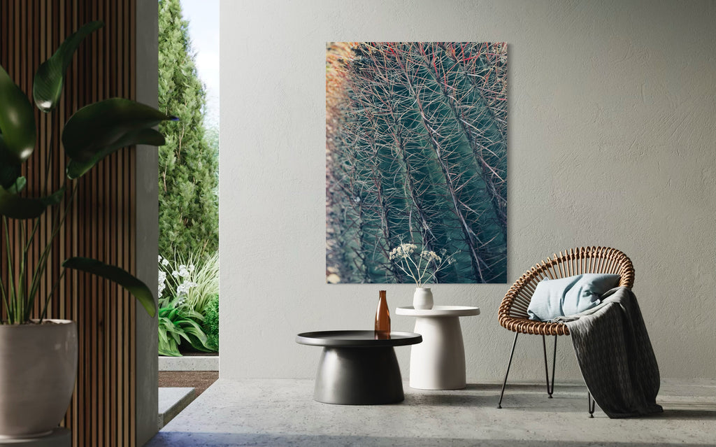 Thorns of Silence fine art artwork hanging in a serene indoor–outdoor space with minimalist concrete tables