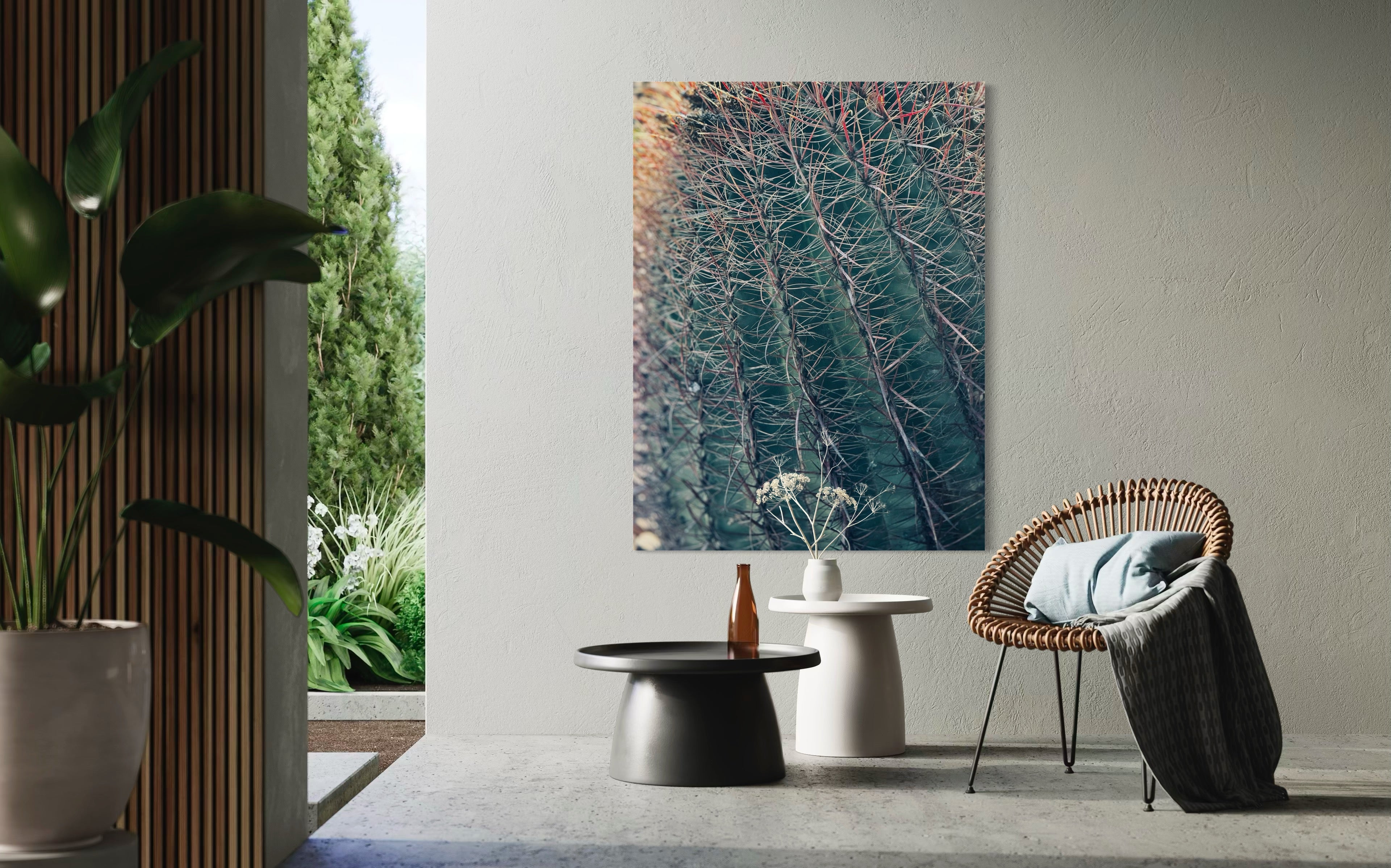 Thorns of Silence fine art artwork hanging in a serene indoor–outdoor space with minimalist concrete tables