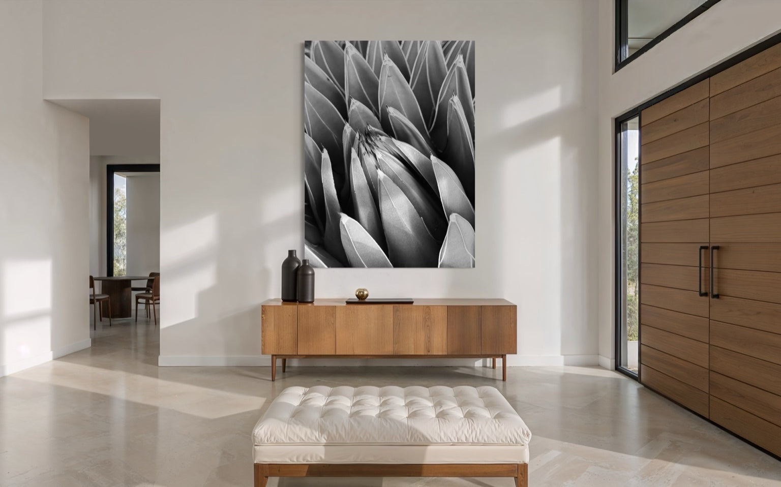 Crown of Quiet centered in a modern foyer, balancing natural wood tones with crisp monochrome form.