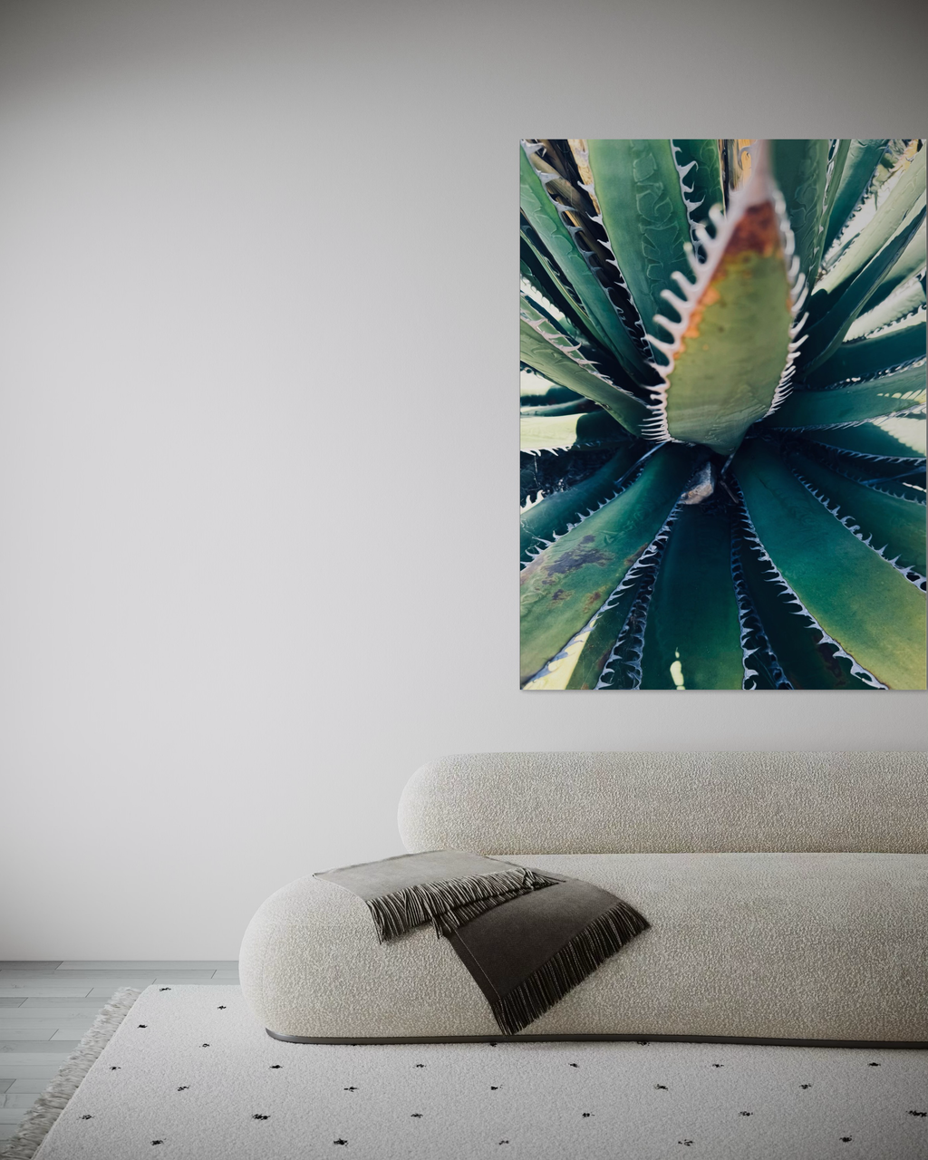 Etherea hung above a soft, minimal sofa, its sharp green symmetry creating a refined focal point.